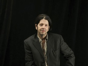 In this Oct. 6, 2009 photo, former Husker Du drummer Grant Hart poses for a photo in Minneapolis. Ken Shipley, who runs the band's record label Numero Group, told The Associated Press that Hart died at the age of 56 Wednesday, Sept. 13, 2017, of cancer at his home in St. Paul, Minn. (Elizabeth Flores/Star Tribune via AP)