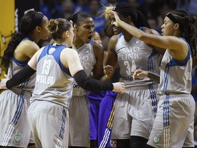 Minnesota Lynx players rgather after center Sylvia Fowles (34) was fouled during a layup attempt in the second quarter against the Los Angeles Sparks in Game 2 of the WNBA basketball finals, Tuesday, Sept. 26, 2017, in Minneapolis, Minn. (Aaron Lavinsky/Star Tribune via AP)