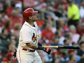 St. Louis Cardinals' Yadier Molina (4) watches a two run home run against the Pittsburgh Pirates' in the second inning of a baseball game, Saturday, Sept.9, 2017, at Busch Stadium in St. Louis. (AP Photo/Bill Boyce)