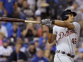 Detroit Tigers' Jeimer Candelario watches an RBI single during the first inning of a baseball game against the Kansas City Royals on Wednesday, Sept. 27, 2017, in Kansas City, Mo. (AP Photo/Charlie Riedel)