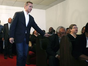 Missouri Gov. Eric Greitens walks in speak to civic leaders and clergy at Washington Metropolitan AME Zion Church ahead of a verdict in the trial of former St. Louis police officer Jason Stockley, Monday, Sept. 11, 2017, in St. Louis. Stockley is accused in the 2011 killing of a black man following a high-speed chase, prompting clergy to warn of possible unrest if he is acquitted. Former St. Louis officer Jason Stockley's trial ended last month, but Judge Timothy Wilson has yet to rule.  (AP Photo/Jeff Roberson)