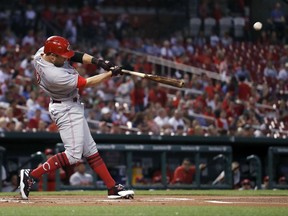 Cincinnati Reds' Zack Cozart hits a solo home run during the first inning of a baseball game against the St. Louis Cardinals on Tuesday, Sept. 12, 2017, in St. Louis. (AP Photo/Jeff Roberson)