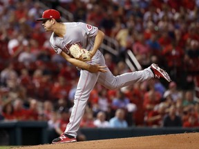 Cincinnati Reds starting pitcher Tyler Mahle watches a throw during the first inning of a baseball game against the St. Louis Cardinals on Wednesday, Sept. 13, 2017, in St. Louis. (AP Photo/Jeff Roberson)