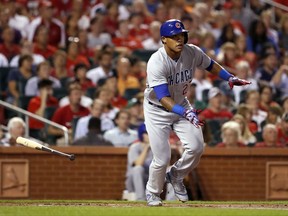 Chicago Cubs' Addison Russell watches his three-run double during the first inning of a baseball game against the St. Louis Cardinals on Monday, Sept. 25, 2017, in St. Louis. (AP Photo/Jeff Roberson)