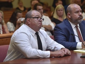 Missouri Highway Patrol trooper Anthony Piercy, left, appears in court as he is sentenced on Tuesday, Sept. 19, 2017, in Versailles, Mo. Piercy will spend 10 days in jail and two years on supervised probation for the death of a handcuffed man who drowned when he fell out of the trooper's boat. (Keith Myers/The Kansas City Star via AP)