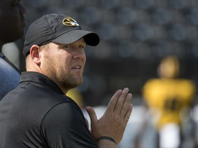 Missouri head coach Barry Odom watches his team warm up before the start of an NCAA college football game against Missouri State, Saturday, Sept. 2, 2017, in Columbia, Mo. (AP Photo/L.G. Patterson)