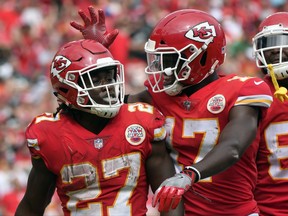 Kansas City Chiefs running back Kareem Hunt (27) is congratulated by wide receiver Chris Conley (17) after scoring a touchdown against the Philadelphia Eagles during the second half of an NFL football game in Kansas City, Mo., Sunday, Sept. 17, 2017. (AP Photo/Ed Zurga)
