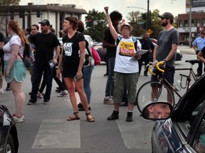 Protesters briefly block Skinker Boulevard at Clayton Road after marching through The Cheshire Hotel in Richmond Heights on Thursday, Sept. 21, 2017. About 40 demonstrators came to the hotel after claiming that downtown hotel guests had been told to go to the Cheshire after last weekend's march. (Robert Cohen/St. Louis Post-Dispatch via AP)