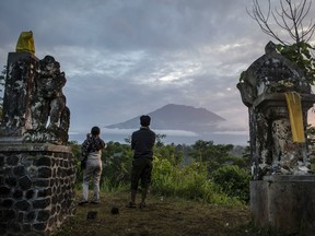 Indonesian authorities raised the alert level for the Mount Agung volcano to the highest level as up to 30,000 villagers around the mountain evacuated their homes and travel warnings have been issued for the popular tourist destination.