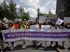 Women carry a banner that reads in Spanish "#We want ourselves alive," during a demonstration to protest violence against women in Mexico City, Sunday, Sept. 17, 2017. Protesters demanded justice for Mara Castilla, a young woman who was last seen entering a ride-sharing app cab and who was later found dead. The case has shocked Mexicans who thought the ride-sharing apps were safer than the country notoriously dangerous taxis.  (AP Photo/Eduardo Verdugo)