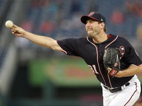 Washington Nationals starting pitcher Max Scherzer delivers during the first inning of a baseball game against the Philadelphia Phillies, Friday, Sept. 8, 2017, in Washington. (AP Photo/Nick Wass)