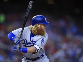 Los Angeles Dodgers Justin Turner eyes the ball during the first inning of a baseball game against the Washington Nationals in Washington, Friday, Sept. 15, 2017. Turner hit a home run. (AP Photo/Manuel Balce Ceneta)
