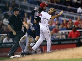 Atlanta Braves' Lane Adams (16), slides safely into third on his triple while Washington Nationals third baseman Anthony Rendon, right, waits for the ball during the fifth inning of a baseball game in Washington, Wednesday, Sept. 13, 2017. Adams later scored a run on teammate Ozzie Albies' single. (AP Photo/Manuel Balce Ceneta)