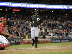 Pittsburgh Pirates' Sean Rodriguez scores on a Max Moroff triple during the ninth inning of a baseball game against the Washington Nationals, Saturday, Sept. 30, 2017, in Washington. The Pittsburgh Pirates won the game 4-1. (AP Photo/Mark Tenally)