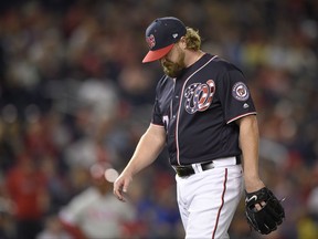 Washington Nationals relief pitcher Shawn Kelley walks to the dugout after he was pulled during the ninth inning of a baseball game against the Philadelphia Phillies, Friday, Sept. 8, 2017, in Washington. (AP Photo/Nick Wass)