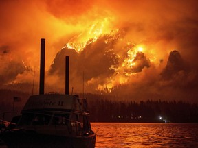 This photo provided by KATU-TV shows the Eagle Creek wildfire as seen from Stevenson Wash., across the Columbia River, burning in the Columbia River Gorge above Cascade Locks, Ore., on Monday Sept. 4, 2017. Wildfire smoke is especially dangerous to people with chronic heart and lung problems, said Julie Fox, an environmental epidemiologist with the Washington State Department of Health. The smoke is a combination of several toxins, and its tiny particles can be inhaled deeply into the lungs, she said. (Tristan Fortsch/KATU-TV via AP)
