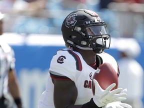 South Carolina's Deebo Samuel (1) catches the opening kickoff from North Carolina State and returns it for a touchdown during the first half of an NCAA college football game in Charlotte, N.C., Saturday, Sept. 2, 2017. (AP Photo/Bob Leverone)