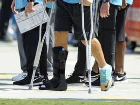 Carolina Panthers' Greg Olsen stands on crutches in the second half of an NFL football game against the Buffalo Bills in Charlotte, N.C., Sunday, Sept. 17, 2017. Olsen was injured earlier in the game. (AP Photo/Mike McCarn)