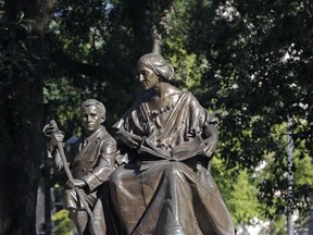 This Tuesday, Sept. 19, 2017, photo shows a monument recognizing the North Carolina women of the Confederacy at the state Capitol in Raleigh, N.C. North Carolina Republican lawmakers on Thursday pressed a state panel not to grant Democratic Gov. Roy Cooper's request to relocate Confederate monuments from the old Capitol grounds, with one leader predicting that any such approval would be overturned in court. (AP Photo/Gerry Broome)