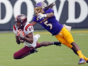Virginia Tech's James Clark (89) hauls in a pass in front of East Carolina's Corey Seargent (5) during the first half of an NCAA college football game in Greenville, N.C., Saturday, Sept. 16, 2017. (AP Photo/Karl B DeBlaker)