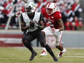 Marshall wide receiver Tyre Brady (8) beats North Carolina State cornerback Johnathan Alston (5) for a 75-yard touchdown reception during the first half of an NCAA college football game Saturday, Sept. 9, 2017, in Raleigh, N.C. (Ethan Hyman/The News & Observer via AP)