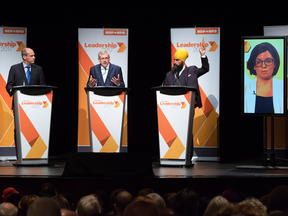NDP leadership candidates, left to right, Guy Caron, Charlie Angus, Jagmeet Singh and Niki Ashton (via satellite) at a debate on Sept 1 in Ottawa.
