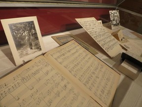 In this Wednesday, Sept. 6, 2017 photo a photograph of composer Amy Beach and some of her musical scores are displayed at the University of New Hampshire in Durham, NH. The University is marking her 150th birthday with an academic conference, musical performances and a museum exhibit. Beach, who was born in Henniker, NH., was the first female composer in America to write a symphony and gained international fame as the "dean of American women composers." (AP Photo/Holly Ramer)