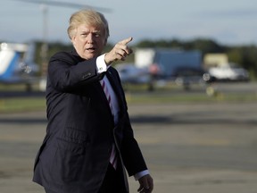President Donald Trump gestures as he walks to board Air Force One to travel to Huntsville, Ala., for a campaign rally for Senate candidate Luther Strange, Friday, Sept. 22, 2017, in Morristown, N.J. (AP Photo/Evan Vucci)