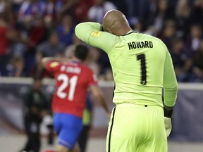 U.S. goalkeeper Tim Howard, right, gets up after allowing a goal to Costa Rica forward Marco Urena during the first half of a World Cup qualifying soccer match, Friday, Sept. 1, 2017, in Harrison, N.J. (AP Photo/Julio Cortez)