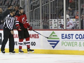 New Jersey Devils right wing Jimmy Hayes (10) complains after being called for one of many penalties during the first period of a preseason NHL hockey game against the Washington Capitals Monday, Sept. 18, 2017, in Newark, N.J. (AP Photo/Mel Evans)