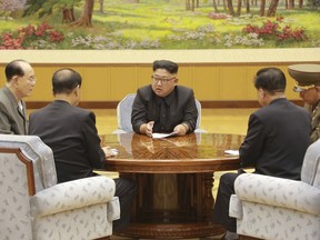 In this Sept. 3, 2017, image distributed on Monday, Sept. 4, 2017, by the North Korean government, North Korea's leader Kim Jong Un holds a meeting of the ruling party's presidium.