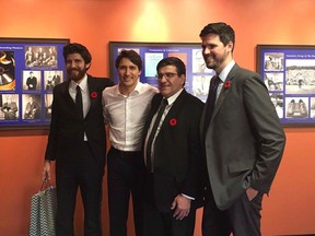 Prime Minister Justin Trudeau poses for a photo with members of the Hadhad family, including Tareq Hadhad, left, in an undated handout photo