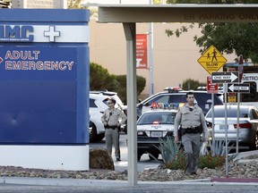 Las Vegas police work on the scene of an officer-involved shooting at University Medical Center on Monday, Sept. 25, 2017, in Las Vegas. Authorities say a man shot dead by a patrol officer was in police custody and under observation for intoxication when he obtained a stun gun and pointed it at a security guard and nurse. (Bizuayehu Tesfaye/Las Vegas Review-Journal via AP)