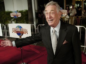 FILE - In this Dec. 16, 2004 file photo, comedian Shelley Berman, who has a role in the new film "Meet the Fockers," poses at the premiere of the film in Universal City, Calif.  Berman, whose groundbreaking routines in the 1950s and 1960s addressed the annoyances of everyday life, has died. He was 92. Publicist Glenn Schwartz says Berman died Friday, Sept. 1, 2017 at his home in Bell Canyon, Calif. He was 92. (AP Photo/Chris Pizzello)