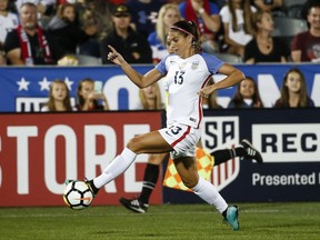 In this Sept. 15, 2017 photo, U.S. forward Alex Morgan (13) moves the ball against New Zealand during the first half of an international friendly soccer match in Commerce City, Colo. The U.S. Women's National Team Players Association is donating $16,000 to help get the union for players in the National Women's Soccer League off the ground. The NWSL Players Association represents more than 160 players who are not paid by the U.S. and Canadian soccer federations. Those federations pay the salaries of several national team players who are allocated across the five-year-old women's professional league.(AP Photo/Jack Dempsey)