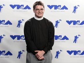 FILE- In this Sunday, Aug. 27, 2017, file photo, Rev. Robert Wright Lee, a descendant of Confederate Army General Robert E. Lee, poses in the press room at the MTV Video Music Awards at The Forum in Inglewood, Calif. Lee is stepping down as pastor of the Bethany United Church of Christ in Winston-Salem, N.C., after negative reactions to his comments supporting racial justice activists on an MTV broadcast. (Photo by Jordan Strauss/Invision/AP, File)