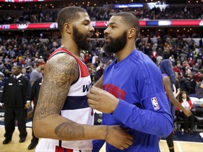 FILE - In this Feb. 19, 2016, file photo, Washington Wizards forward Markieff Morris, left, and Detroit Pistons forward Marcus Morris talk on the court after an NBA basketball game in Washington. A trial will begin for NBA players Marcus and Markieff Morris, who allegedly assaulted a man outside a Phoenix recreation center two years ago. Maricopa County Superior Court officials announced the trial's upcoming jury selection will start Wednesday morning, Sept. 13, 2017. (AP Photo/Alex Brandon, File)