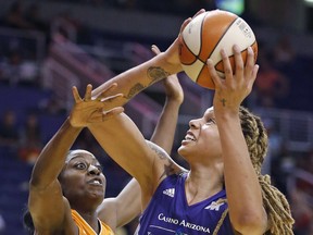 FILE - in this May 31, 2016, file photo, Phoenix Mercury's Brittney Griner (42) is fouled as she goes up for a shot against Connecticut Sun's Chiney Ogwumike during a WNBA basketball game in Phoenix. Griner and many other WNBA players and teams are finding their own ways to help Houston and the surrounding area in the aftermath of Hurricane Harvey. (AP Photo/Ross D. Franklin, File)