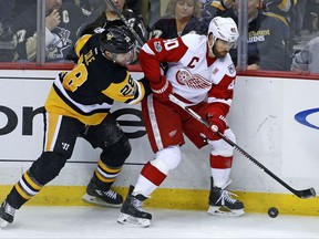 FILE - In this Feb. 19, 2017, file photo, Detroit Red Wings' Henrik Zetterberg (40) works in the corner against Pittsburgh Penguins' Ian Cole (28) during an NHL hockey game in Pittsburgh. Detroit hopes captain Zetterberg has at least another great season left in his career. (AP Photo/Gene J. Puskar)