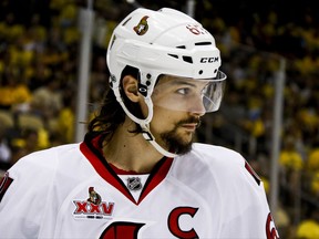 FILE - In this May 16, 2017,  file photo, Ottawa Senators' Erik Karlsson prepares for a face-off during the second period of Game 2 of the Eastern Conference finals against the Pittsburgh Penguins, in Pittsburgh. Senators captain Erik Karlsson has no timetable to get back on the ice or play following offseason foot surgery. Karlsson, the runner-up for the Norris Trophy as the NHL's top defenseman, says he hasn't been able to do anything for three months since the operation in June to repair torn tendons in his left foot. (AP Photo/Gene J. Puskar, File)