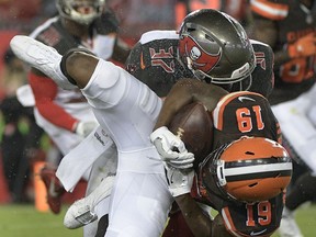 FILE - In this Aug. 26, 2017, file photo, Cleveland Browns wide receiver Corey Coleman (19) is taken down by Tampa Bay Buccaneers strong safety Keith Tandy (37) during the first quarter of an NFL preseason football game, in Tampa, Fla. Coleman broke his right hand during Sunday's Sept. 17, 2017,  loss in Baltimore and is having surgery. Coach Hue Jackson did not give a timetable on his return. (AP Photo/Phelan Ebenhack, File)
