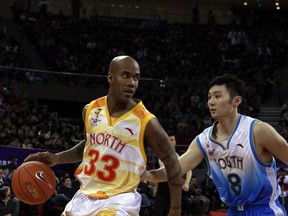 FILE - In this March 21, 2010, file photo, Stephon Marbury of China North team drives the ball down the court against Liu Wei of China South team, during the China Basketball Association's all-star game in Beijing.  Marbury hopes to finish off his basketball career back in the NBA. The 40-year-old guard is playing in the Chinese Basketball Association this season for the Beijing Fly Dragons and then when the league ends in February or March he wants to join an NBA franchise. (AP Photo/Gemunu Amarasinghe, File)