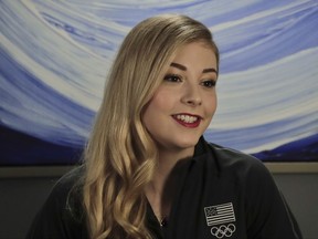FILE - In this Feb. 7, 2017, file photo, U.S. figure skating star Gracie Gold answers questions during an interview in New York. Gracie Gold is stepping away from the sport to seek professional help with the Olympics a little more than five months away. The 2014 Olympic bronze medalist and two-time national champion did not specify in a statement to U.S. Figure Skating what sort of help she needs. She said Friday, Sept. 1, 2017,  her "passion for skating and training remains strong" and she will be away for "some time." She hopes this will allow her to become a "stronger person."(AP Photo/Julie Jacobson, File)
