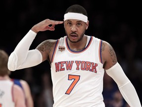 FILE - In this March 27, 2017, file photo, New York Knicks forward Carmelo Anthony (7) reacts after hitting a 3-point shot against the Detroit Pistons during the second quarter of an NBA basketball game in New York. The Knicks agreed to trade Anthony to the Thunder on Saturday, Sept. 23, 2017, saving themselves a potentially awkward reunion next week with the player they'd been trying to deal since last season.  New York will get Enes Kanter, Doug McDermott and a draft pick, a person with knowledge of the deal said. The person spoke with The Associated Press on condition of anonymity because the trade had not been announced.  (AP Photo/Julie Jacobson, File)