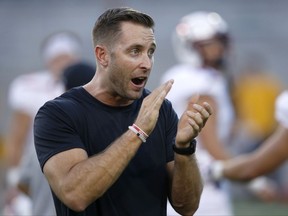 FILE - This Sept. 10, 2016, file photo shows Texas Tech head coach Kliff Kingsbury applauding as they warm up prior to an NCAA college football in Tempe, Ariz. Kingsbury's fifth season begins at home Saturday against Eastern Washington, the FCS leader with 401 yards passing per game last season. (AP Photo/Ross D. Franklin, File)