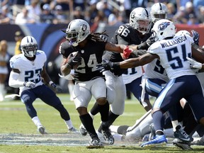 FILE - In this Sept. 10, 2017, file photo, Oakland Raiders running back Marshawn Lynch (24) carries the ball against the Tennessee Titans during the second half of an NFL football game in Nashville, Tenn. Carr and the Raiders play their home-opener against the New York Jets on Sunday, Sept. 17. Lynch came out of retirement this offseason for the opportunity to play for the Raiders before the team moves to Las Vegas in 2020. (AP Photo/Mark Zaleski, File)