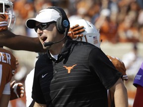 FILE - In this Sept. 9, 2017, file photo, Texas head coach Tom Herman talks with players on the sideline during an NCAA college football game against San Jose State, in Austin, Texas. Herman took over a Texas program with plenty of ups and downs since being the league's last national champ 12 seasons ago, Matt Rhule never expected his job at Baylor to be easy, and Lincoln Riley suddenly was leading the 10-time league champ with a Heisman Trophy-caliber quarterback. The results so far clearly reflect the situations inherited by the Big 12's three new head coaches. (AP Photo/Eric Gay, File)