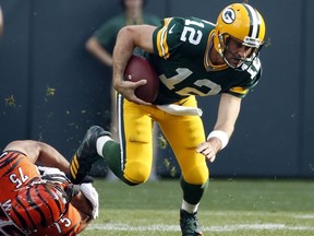FILE - In this Sunday, Sept. 24, 2017, file photo, Green Bay Packers' Aaron Rodgers tries to get away from Cincinnati Bengals' Jordan Willis during the first half of an NFL football game in Green Bay, Wis. The Chicago Bears and Green Bay Packers will renew the NFL's oldest rivalry when they meet on Thursday night at Lambeau Field. (AP Photo/Mike Roemer, File)