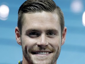FILE - In this Aug. 20, 2016, file photo, United States' bronze medalist David Boudia poses during the medal ceremony for the men's 10-meter platform diving final at the 2016 Summer Olympics in Rio de Janeiro, Brazil. Boudia will announce his future in the sport next week. Boudia is planning a news conference Tuesday, Sept. 12, 2017, at Mackey Arena on the campus of Purdue University, his alma mater. A statement from USA Diving says he will be accompanied by coach Adam Soldati and the governing body's CEO, Lee Johnson, as well as family and friends.(AP Photo/Michael Sohn, File)
