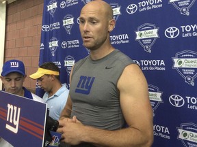 FILE - In this Aug. 18, 2016, file photo, New York Giants' Josh Brown speaks with reporters at NFL football teams training camp in East Rutherford, N.J. The NFL suspended former New York Giants kicker and current free agent Josh Brown for six games, a person familiar told The Associated Press on Friday, Sept. 8, 2017. The decision to extend the ban follows a league review of Brown's repeated abuse of his former wife while they were married. The person spoke on condition of anonymity because the NFL had not released its ruling. (AP Photo/Tom Canavan, File)